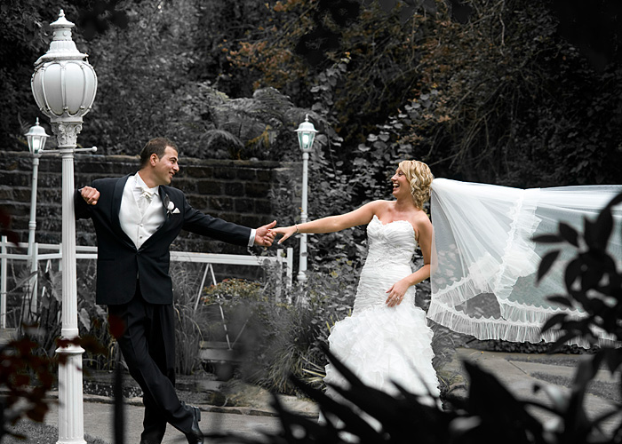 Bridal couple in  a fun candid moment at Bram Leigh Croydon.