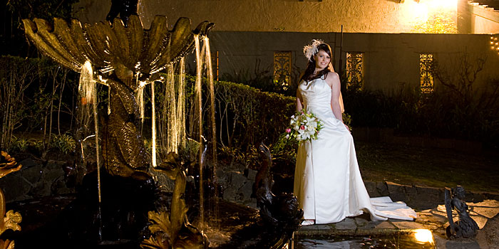 Wedding Photography of a bride with fountain, at night