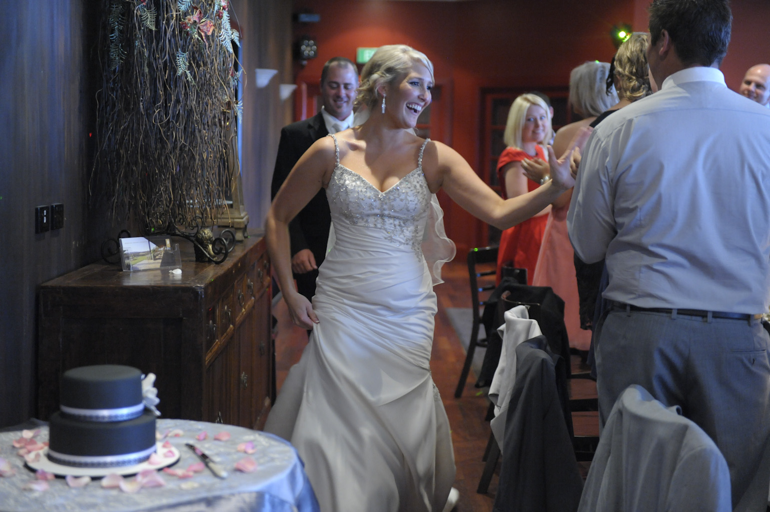 the bride and groom enter their reception at forest edge restaurant gembrook